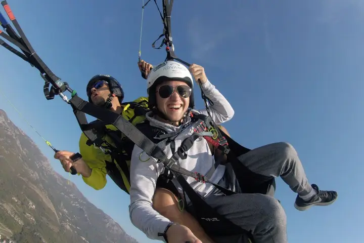 Coastal paragliding view along the Bečići beach line near Budva