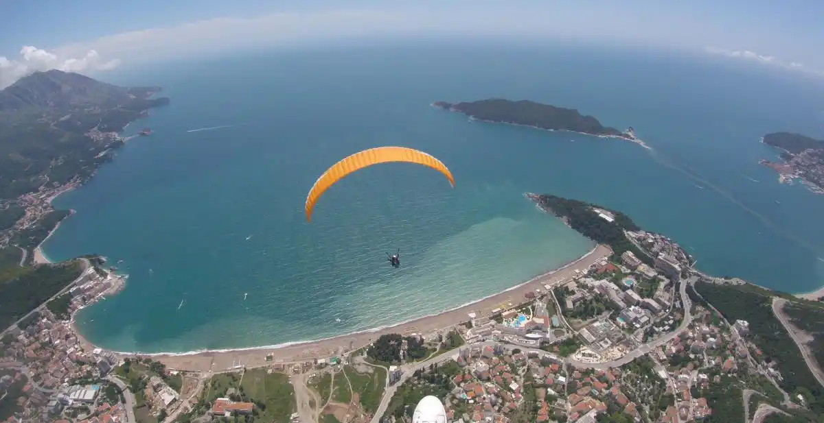 Wide view of the Budva coast and Bečići shoreline from tandem paragliding height
