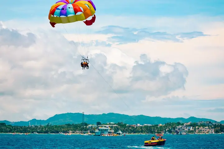 Parasailing take-off from a beach boat setup near Budva and Bečići
