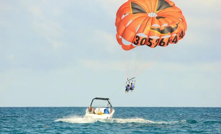 Parasailing canopy towed behind a boat off the Budva coast