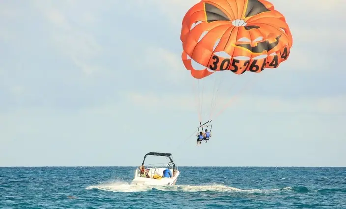 Parasailing canopy towed behind a boat off the Budva coast
